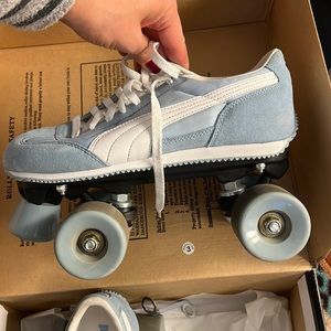 Baby blue puma rollerskates.
